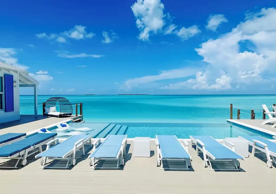An infinity pool overlooking the turquoise water of Exuma, The Bahamas