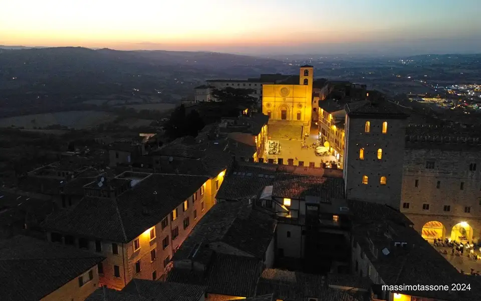 Historic architecture in Todi illuminated at dusk